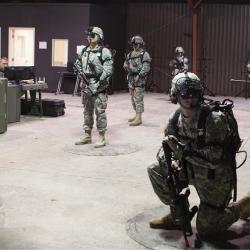 Troops wearing virtual reality gear prepare for training